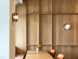 Natural wood panels at Bon'gu adding warmth and sophistication to the dining space. before matter interior design frankfurt before matter, architecture & interior design studio Frankfurt am Main