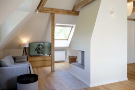 Open-plan design at Kennedyallee with exposed wooden beams, oak flooring, and modern touches before matter, architecture & interior design studio Frankfurt am Main