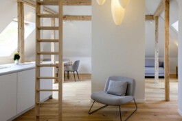 Open-plan design at Kennedyallee with exposed wooden beams, oak flooring, and modern touches before matter, architecture & interior design studio Frankfurt am Main