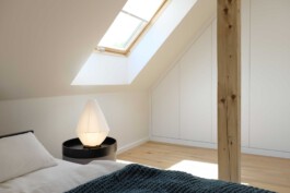 Soft furnishings and paper lanterns add warmth to the minimalist design at Kennedyallee before matter, architecture & interior design studio Frankfurt am Main