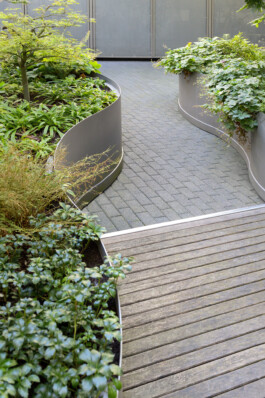Natural stone pavers add texture and depth to the Urban Oasis design before matter, architecture & interior design studio Frankfurt am Main