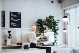 Barista serving specialty coffee at Drei Kaffeebar in a modern café setting before matter, architecture & interior design studio Frankfurt am Main