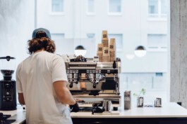 Barista serving specialty coffee at Drei Kaffeebar in a modern café setting before matter, architecture & interior design studio Frankfurt am Main