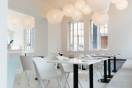 Large paper lanterns cast a warm, ambient glow throughout the Diningraum space before matter, architecture & interior design studio Frankfurt am Main